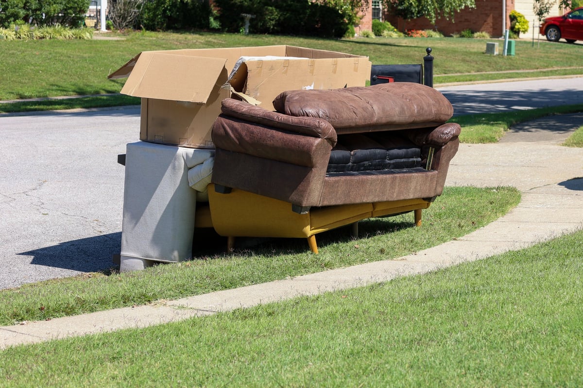 Old furniture being cleared from a property for haul-away